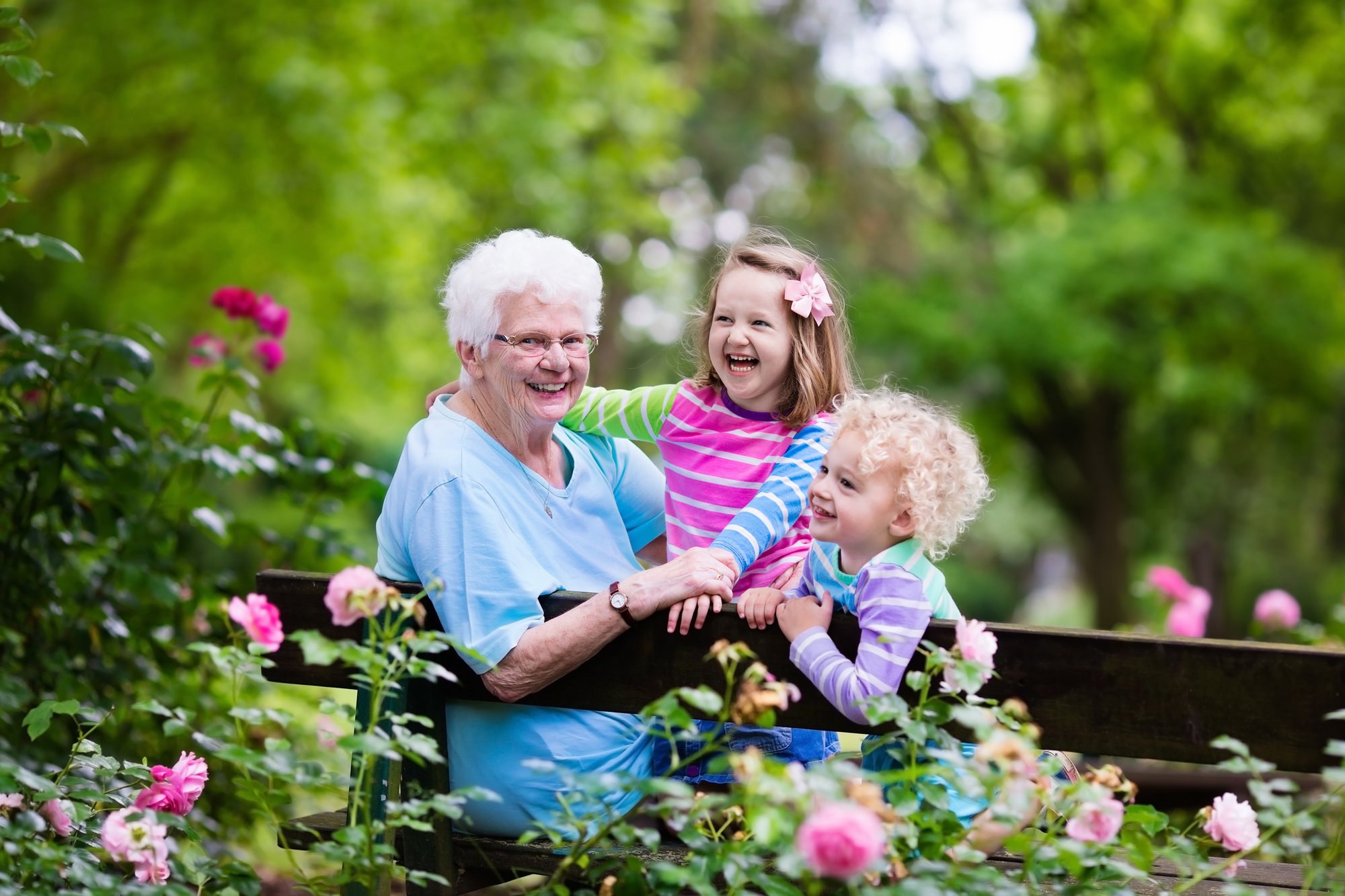 Happy grandmother playing with grandchildren boy and girl in garden_60370298_XXL