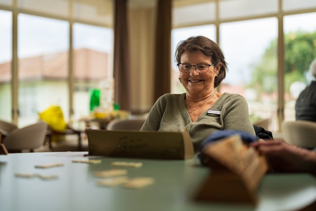 Woman in rest home playing scrabble